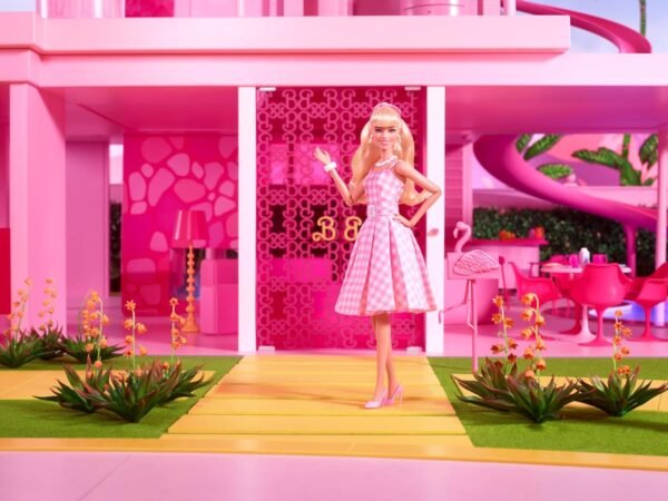 Barbie The Movie Doll Margot Robbie as Collectible Doll Wearing Pink White Gingham Dress with Daisy Chain Necklace.jpg